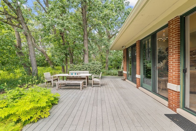 8673 Timber Ridge Dr, Burr Ridge, IL 60527 - deck with outdoor dining space and view of wooded area