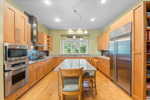 8673 Timber Ridge Dr, Burr Ridge, IL 60527 - kitchen featuring built in appliances, wall chimney exhaust hood, a sink, tasteful backsplash, and light wood-style floors