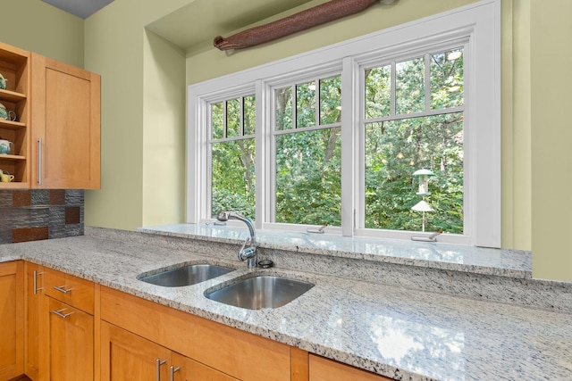 8673 Timber Ridge Dr, Burr Ridge, IL 60527 - kitchen featuring open shelves, a sink, light stone countertops, and tasteful backsplash