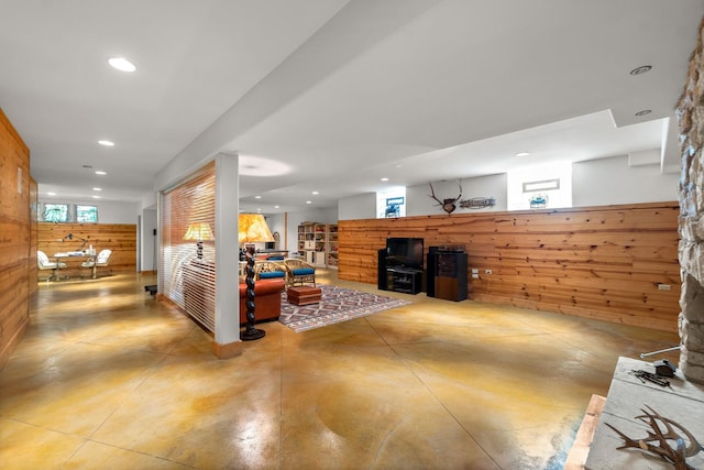 8673 Timber Ridge Dr, Burr Ridge, IL 60527 - living room with finished concrete floors, recessed lighting, and a wood stove