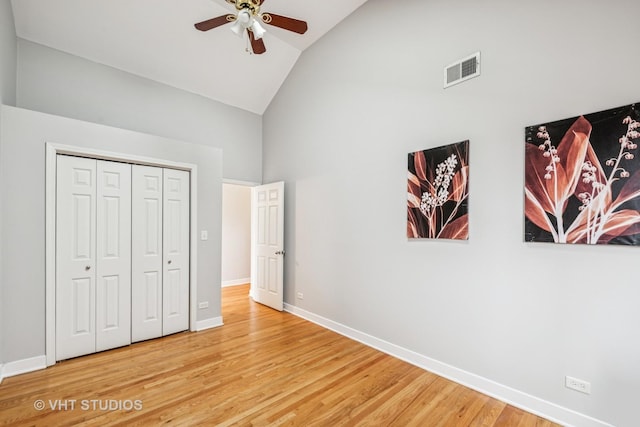 2336 W Harrison St Unit 4, Chicago, IL 60612 - unfurnished bedroom featuring high vaulted ceiling, wood finished floors, baseboards, a closet, and a ceiling fan