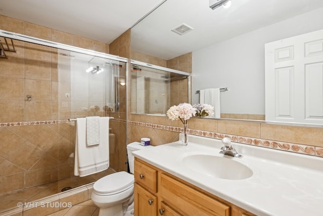 2336 W Harrison St Unit 4, Chicago, IL 60612 - bathroom with vanity, a shower stall, toilet, and tile walls
