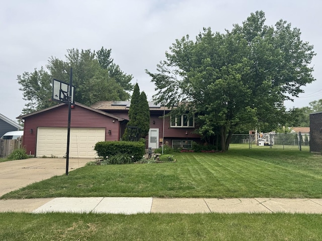 view of front of house with solar panels, concrete driveway, and an attached garage