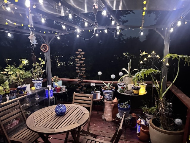 wooden deck featuring outdoor dining area