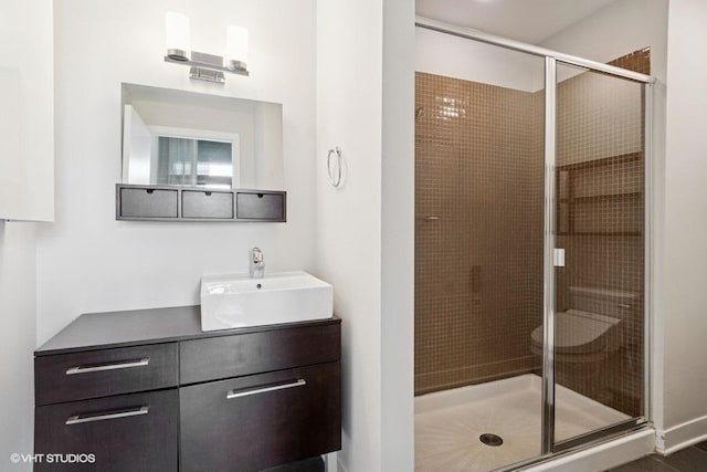 full bath featuring a shower stall and vanity