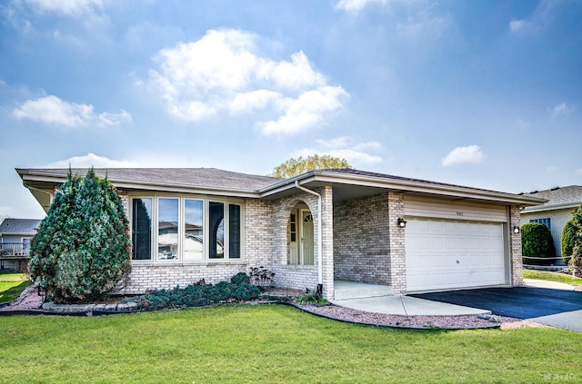 9147 Boardwalk Ter, Orland Hills, IL 60487 - ranch-style home featuring an attached garage, driveway, a front lawn, and brick siding
