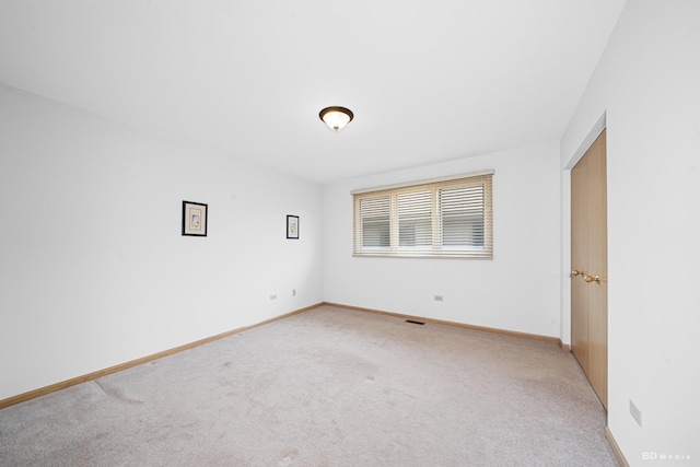 9147 Boardwalk Ter, Orland Hills, IL 60487 - spare room featuring light carpet and baseboards