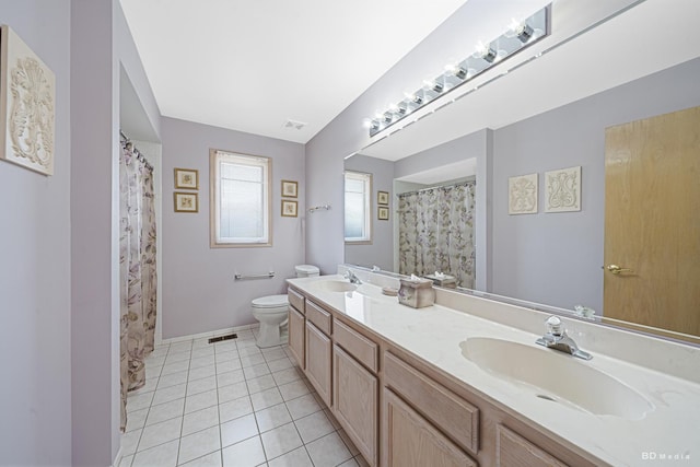 9147 Boardwalk Ter, Orland Hills, IL 60487 - bathroom with tile patterned flooring, visible vents, a sink, and toilet