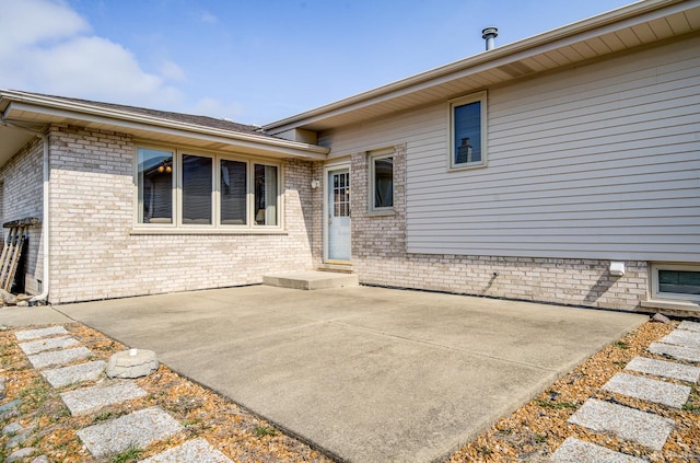 9147 Boardwalk Ter, Orland Hills, IL 60487 - rear view of property featuring a patio and brick siding