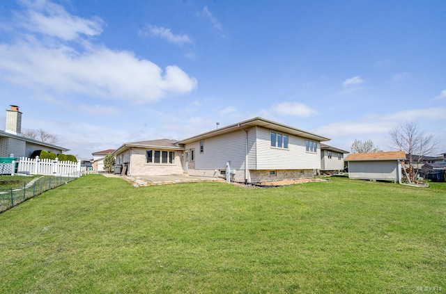 9147 Boardwalk Ter, Orland Hills, IL 60487 - back of house featuring fence and a lawn