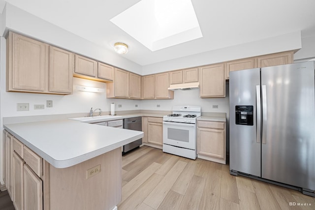 9147 Boardwalk Ter, Orland Hills, IL 60487 - kitchen with stainless steel appliances, under cabinet range hood, light brown cabinetry, and a skylight