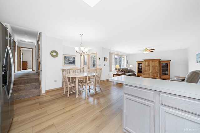 9147 Boardwalk Ter, Orland Hills, IL 60487 - kitchen with a chandelier, stainless steel refrigerator with ice dispenser, open floor plan, and light wood-type flooring