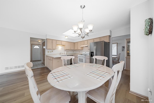 9147 Boardwalk Ter, Orland Hills, IL 60487 - dining space with visible vents, baseboards, light wood finished floors, and a notable chandelier