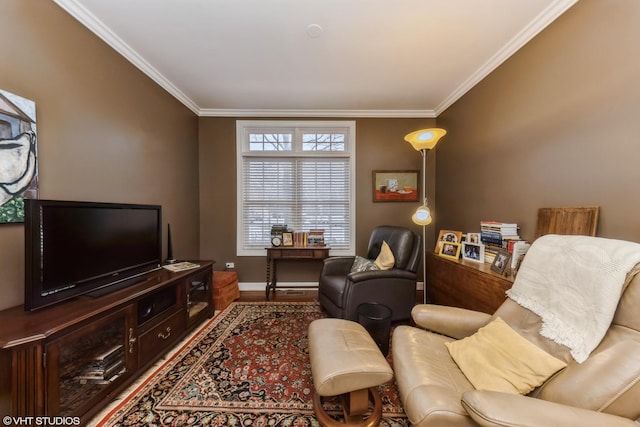 living area featuring wood finished floors, baseboards, and ornamental molding