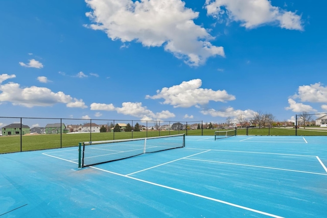 view of sport court with fence