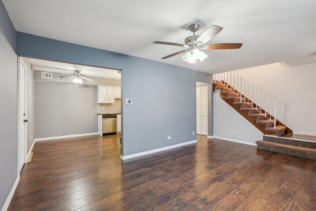 unfurnished living room with dark wood-style floors, stairway, visible vents, and ceiling fan