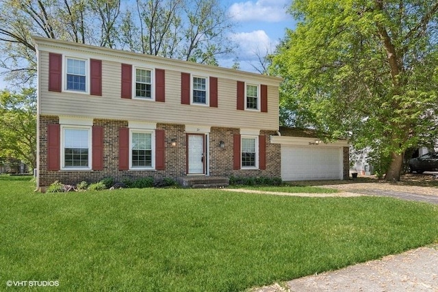 21 39th St, Downers Grove, IL 60515 - view of front of home featuring brick siding, driveway, a front yard, and an attached garage