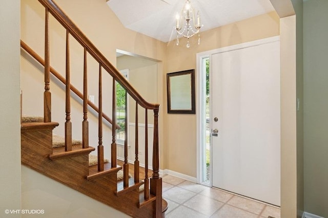 21 39th St, Downers Grove, IL 60515 - foyer featuring a chandelier, stairway, and baseboards