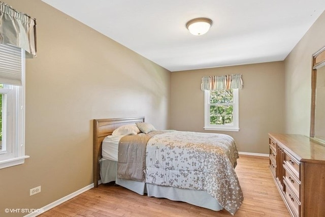 21 39th St, Downers Grove, IL 60515 - bedroom with light wood-type flooring and baseboards