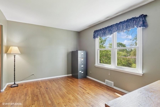 21 39th St, Downers Grove, IL 60515 - unfurnished bedroom with baseboards and light wood-type flooring
