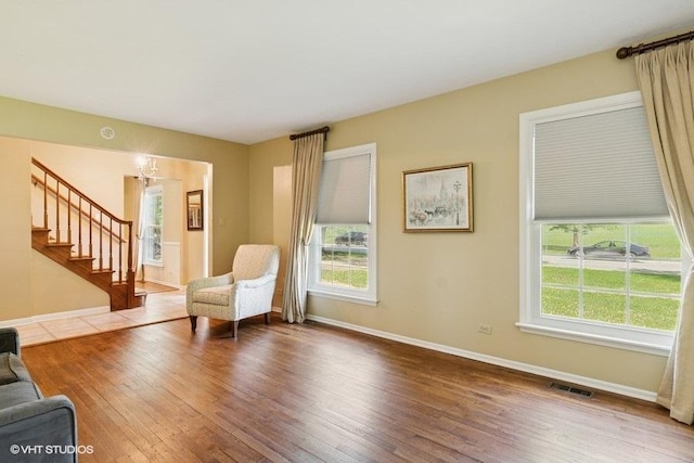 21 39th St, Downers Grove, IL 60515 - living area featuring stairway, wood-type flooring, baseboards, and plenty of natural light