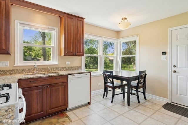 21 39th St, Downers Grove, IL 60515 - kitchen with white appliances, a sink, baseboards, and plenty of natural light