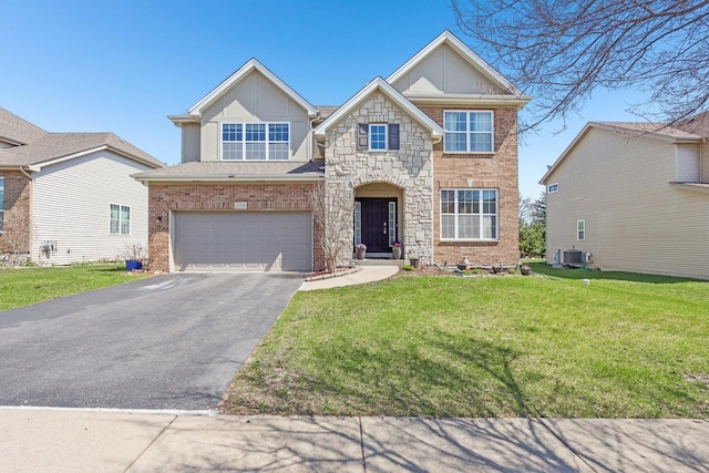 view of front of home featuring central AC unit, aphalt driveway, board and batten siding, and a front lawn