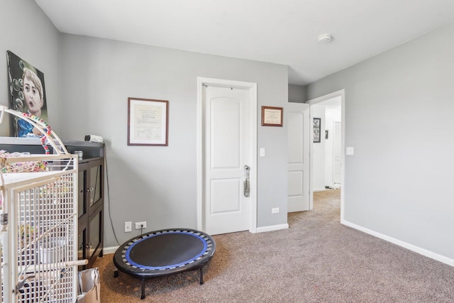 carpeted bedroom with baseboards