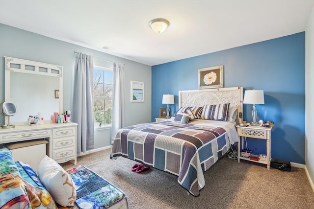carpeted bedroom featuring baseboards and visible vents