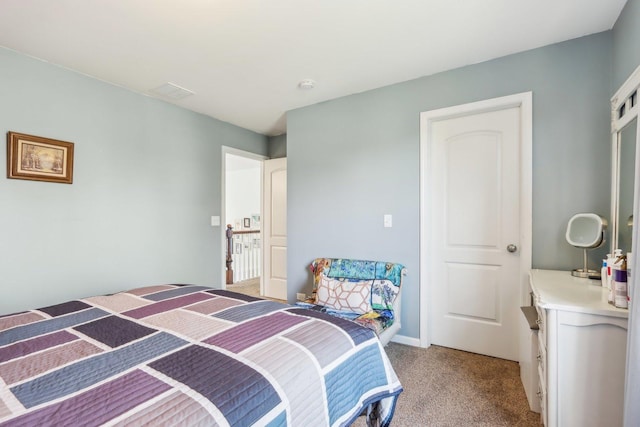 bedroom with light colored carpet
