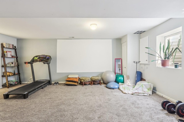 workout area with baseboards, carpet flooring, and visible vents