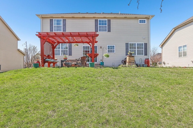 rear view of property with a pergola and a lawn