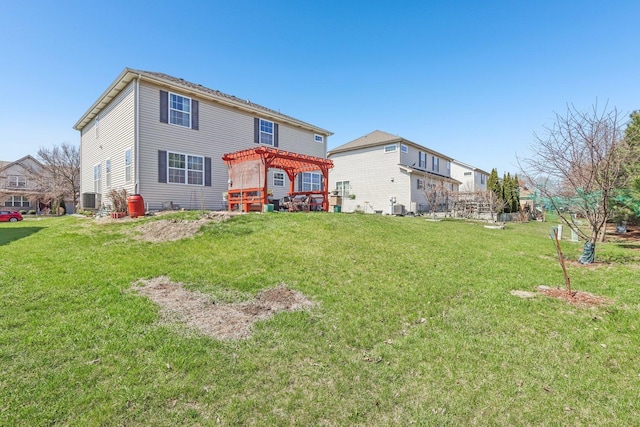 back of house featuring a yard