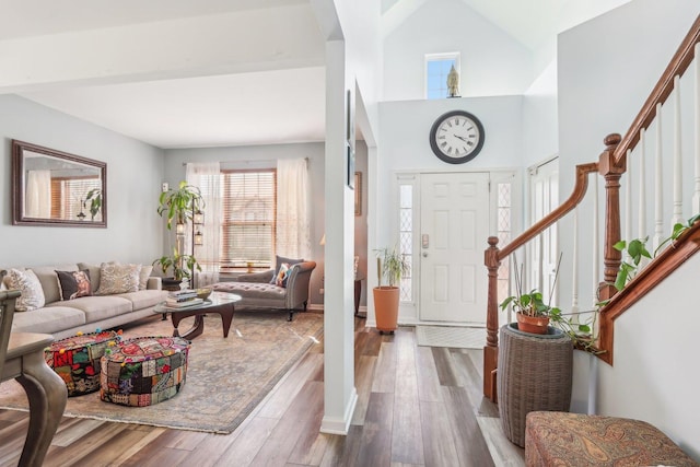 entryway featuring stairway and wood finished floors