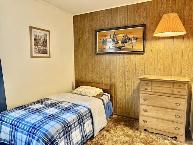 carpeted bedroom with wood walls
