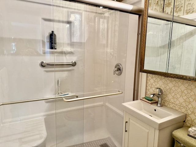 bathroom with vanity and a stall shower