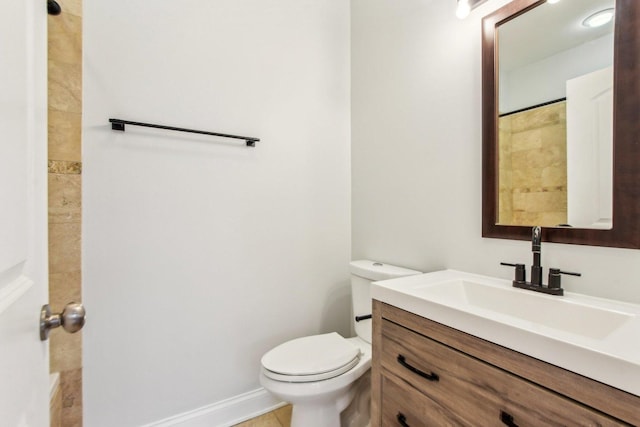 bathroom featuring toilet and vanity