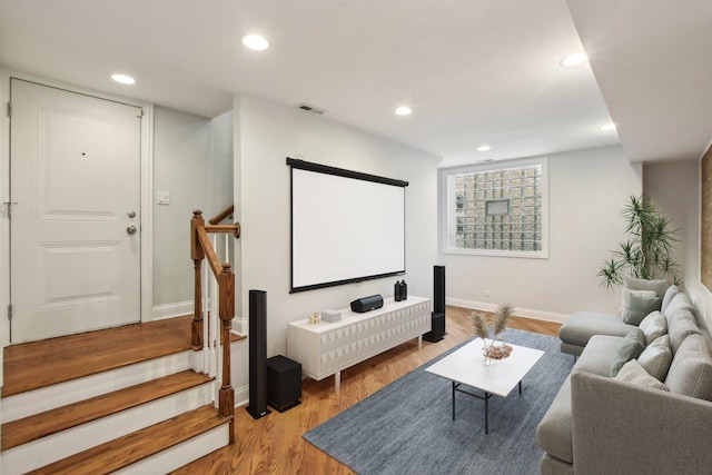 home theater room with visible vents, baseboards, recessed lighting, and light wood-type flooring