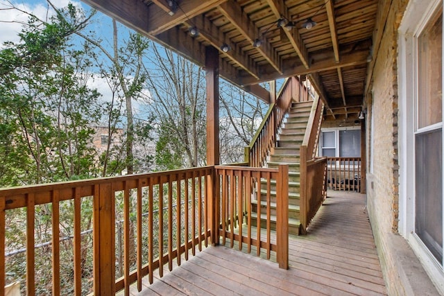 wooden terrace featuring stairs