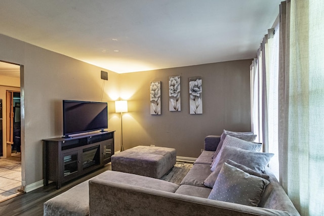 living room featuring wood finished floors and baseboards