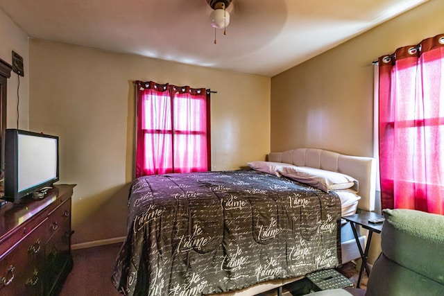 bedroom with carpet flooring and baseboards