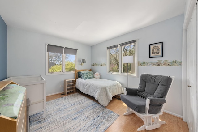 22W128 Butterfield Rd, Glen Ellyn, IL 60137 - bedroom with multiple windows, wood finished floors, and baseboards
