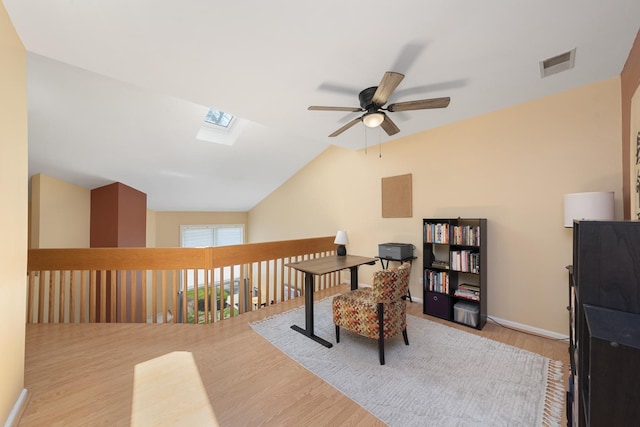 22W128 Butterfield Rd, Glen Ellyn, IL 60137 - office area with ceiling fan, a skylight, wood finished floors, vaulted ceiling, and baseboards