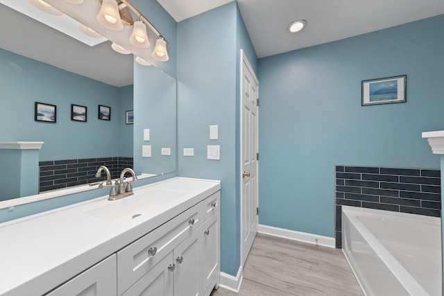 22W128 Butterfield Rd, Glen Ellyn, IL 60137 - full bath with wood finished floors, a garden tub, baseboards, and vanity