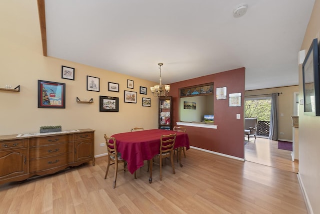 22W128 Butterfield Rd, Glen Ellyn, IL 60137 - dining space with a chandelier, light wood finished floors, and baseboards