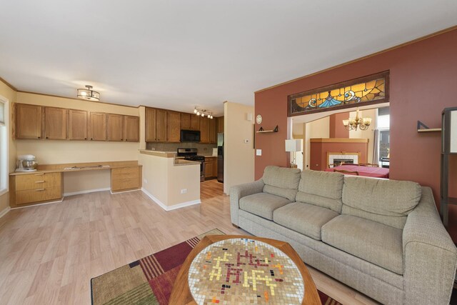 22W128 Butterfield Rd, Glen Ellyn, IL 60137 - living room with light wood-style flooring, a chandelier, and baseboards