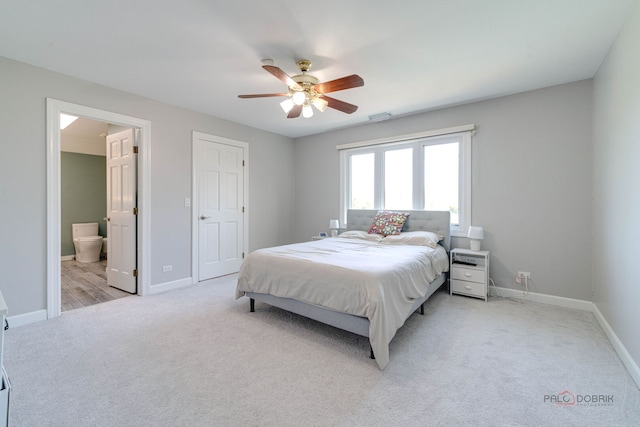 bedroom featuring light colored carpet, visible vents, and baseboards
