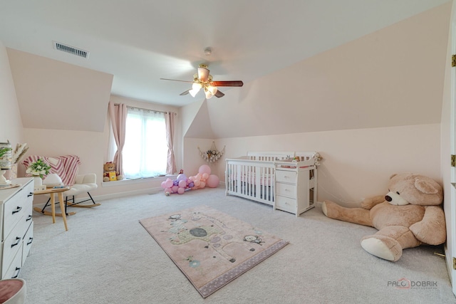 game room with visible vents, ceiling fan, carpet flooring, and vaulted ceiling