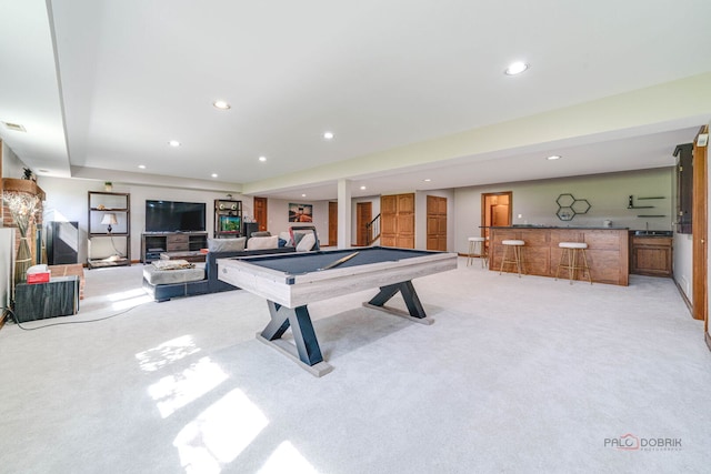 rec room featuring pool table, recessed lighting, wet bar, and light carpet
