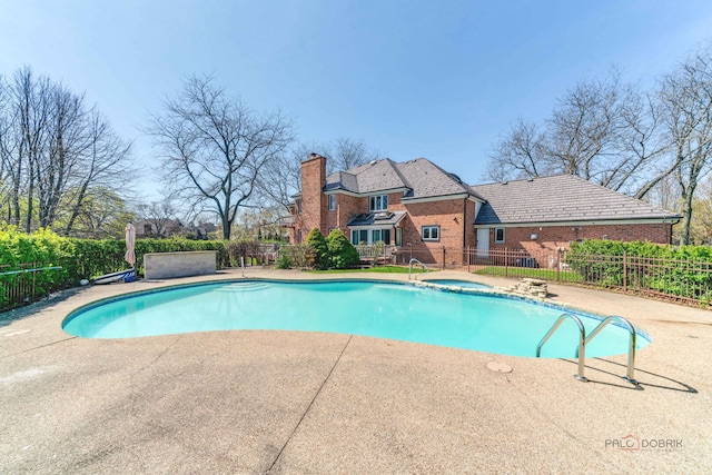 view of swimming pool with a patio, fence, a fenced in pool, and an outdoor hot tub
